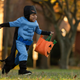 Little boy trick-or-treating in Batman costume